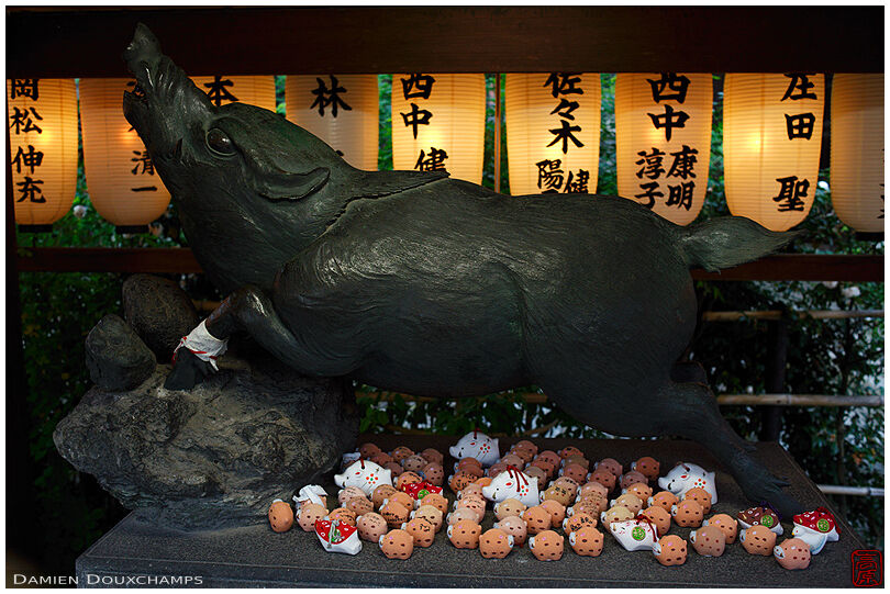 Wild pig statue with small votive offerings, Marishisonten-do temple