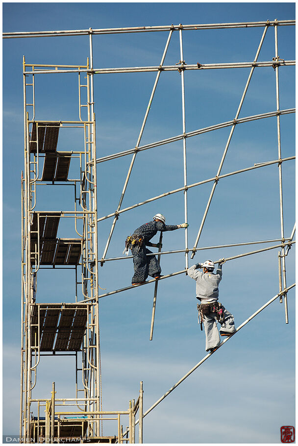 Constrution workers building the scaffold for the renovation of Myoren-ji temple's roof