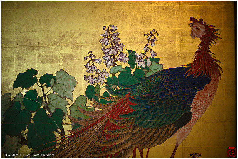 Peacock painting on gold-leaf covered wall