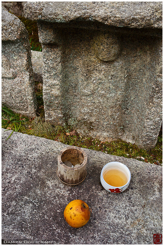 Offerings in front of a jizo statue
