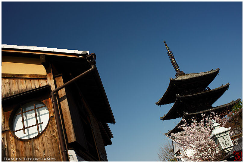Round window and Hokan-ji temple pagoda on a clear blue sky day, Gion, Kyoto, Japan
