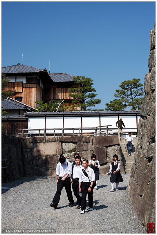 Students on a school tour leaving Nijo-jo castle, Kyoto, Japan