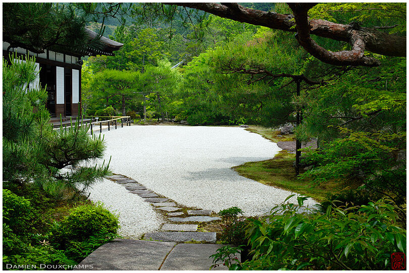 Lush green vegetation around the rock garden of Konchi-in temple, Kyoto, Japan
