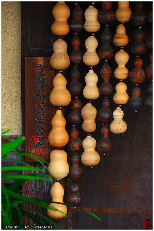 Strings of gourds at the entrance of an old building in Kyoto, Japan