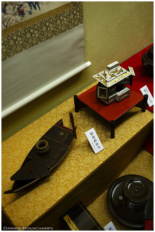Old traditional bento box shaped like a boat in the Hanbei-fu bento museum, Kyoto, Japan