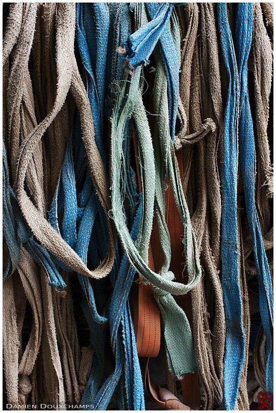 Worn belts and ropes in a stone carving shop, Kyoto, Japan