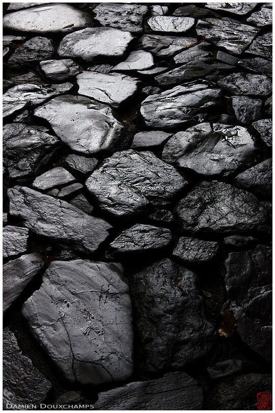Dark and rough pavement on a footpath in Honen-in temple, Kyoto, Japan