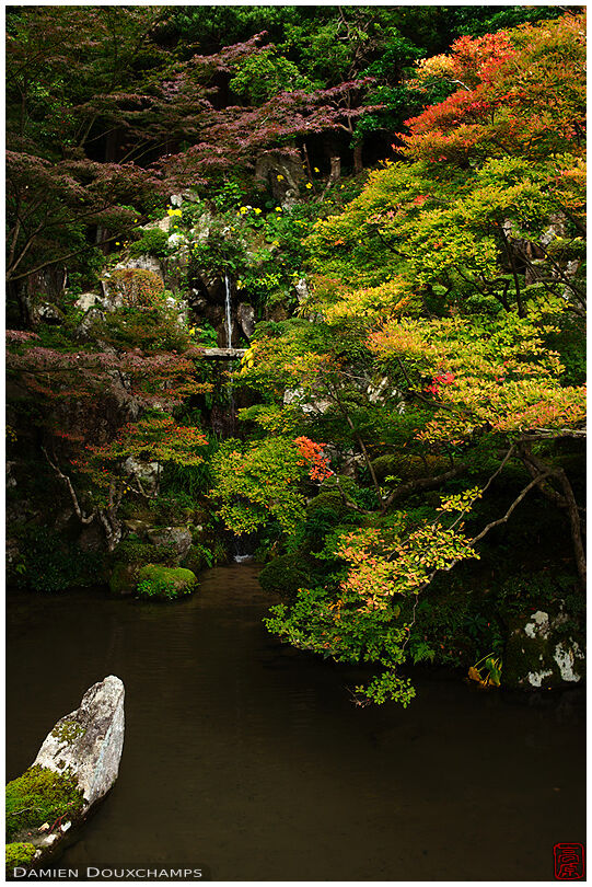 Ship-shaped stone on pod under autumn colours, Kongorin-ji temple, Shiga, Japan