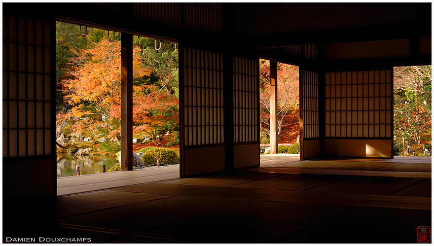 Dark hall with view on autumn colours, Tenryu-ji temple, Kyoto, Japan