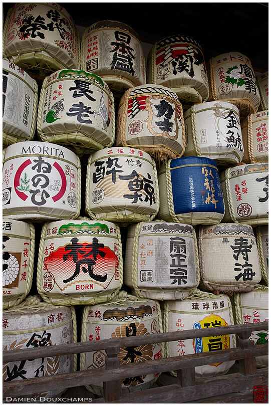Pile of sake barrels offerings in Matsuo shrine, Kyoto, Japan