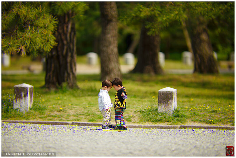 Two small kids in the Imperial Gardens, Kyoto, Japan