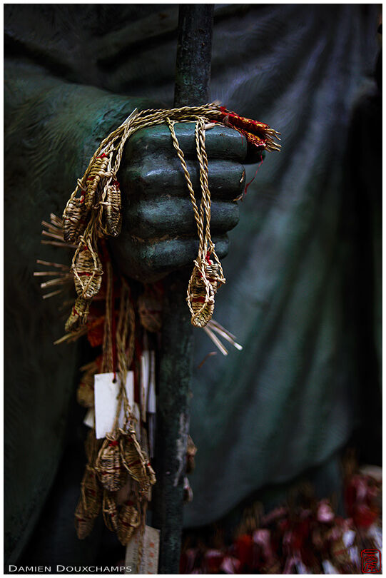 Sandal votive offerings hung to pilgrim statue, Kyoto, Japan