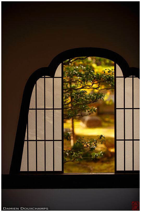 Golden light and bellflower shaped window, Tenkyu-in temple, Kyoto, Japan