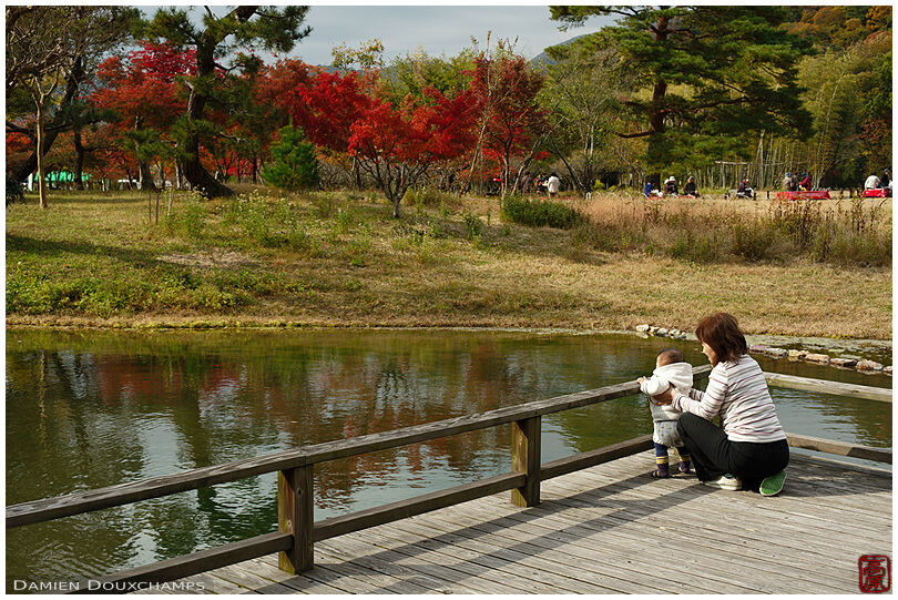 Woman and her child in the Heian-kyo garden, Kyoto, Japan