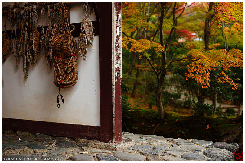 Pilgrim rope sandals as votive offerings hanged to the main gate of Jojakko-ji temple, Kyoto, Japan