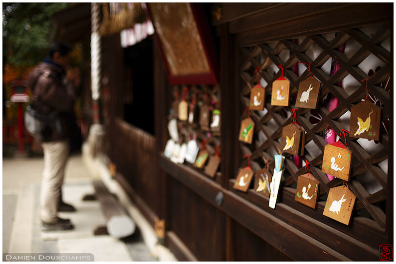Votive offerings hung to the walls of Saginomori shrine, Kyoto, Japan