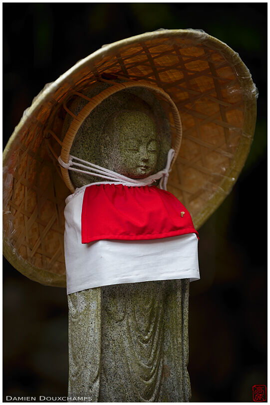 Jizo statue with bib and straw hat, Konzo-ji temple, Kyoto, Japan