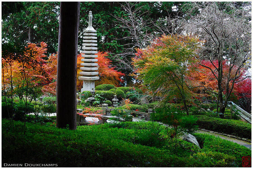 Stone pagoda and autumn colours in the upper garden of Yoshimine-dera temple, Kyoto, Japan