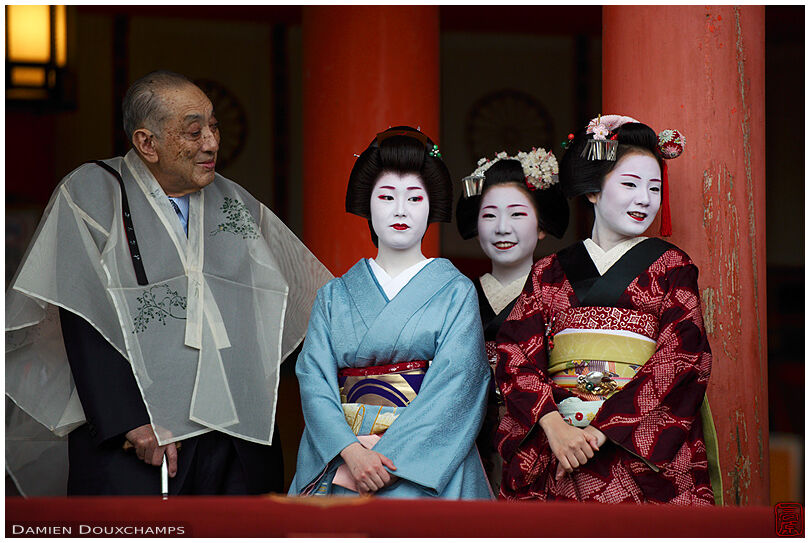 A geisha and two maiko during the setsubun festival in Heian Jingu shrine, Kyoto, Japan