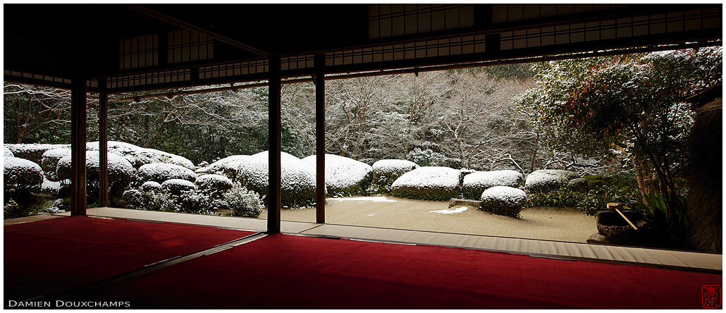 Light sprinkle of snow on the azalea bushes of Shisendo temple, Kyoto, Japan