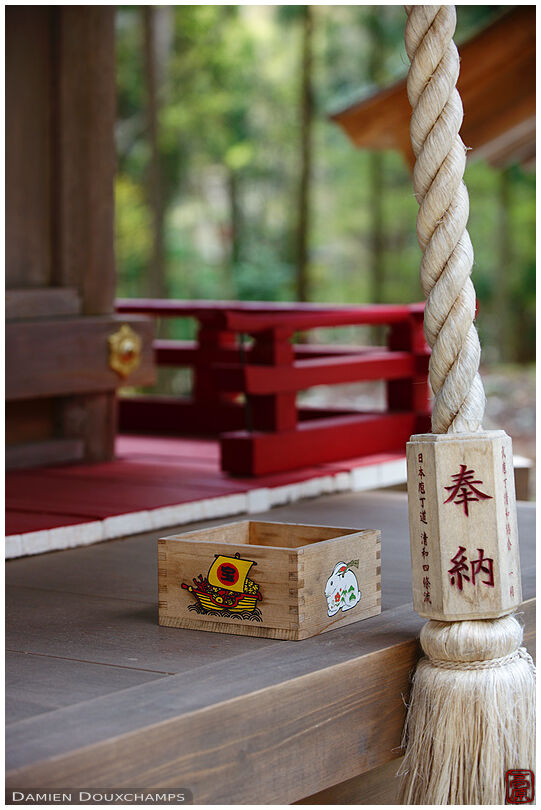 Bell rope and offering box on a small sub shrine of Hiyoshi-taisha, Shiga, Japan