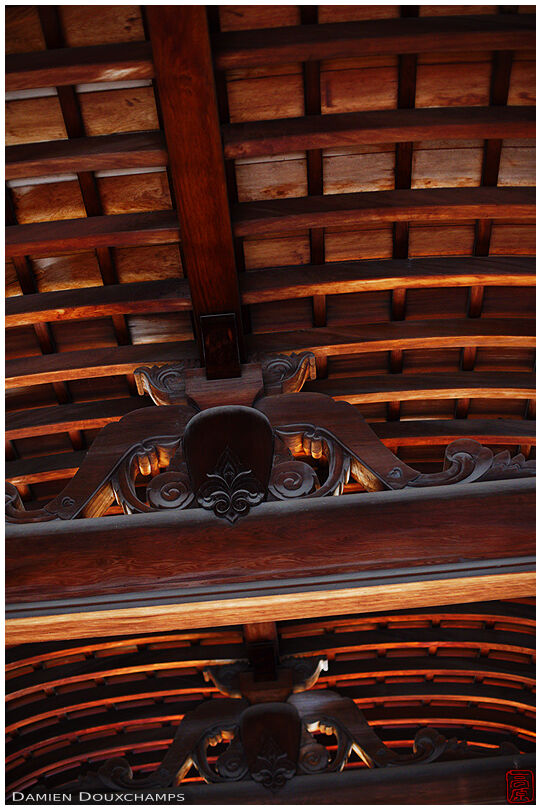 Elaborate red wood ceiling structure in Omi-jingu shrine, Shiga, Japan