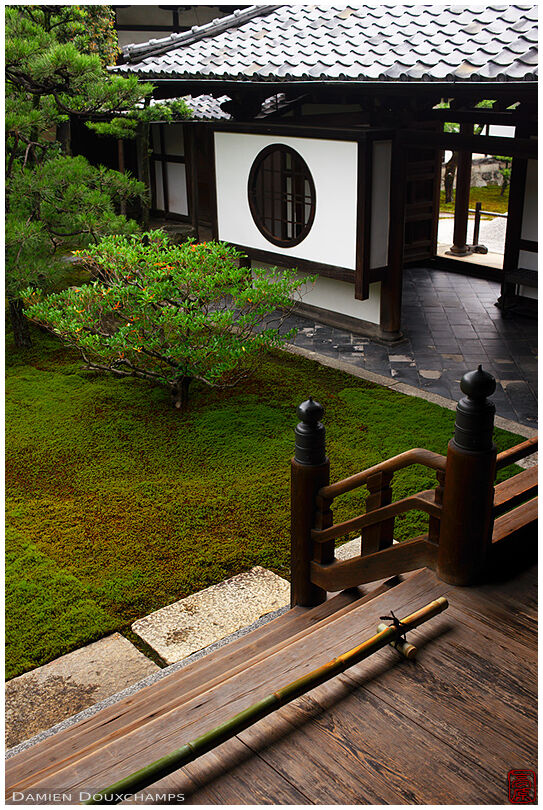 Round window and moss garden in Ryosoku-in temple, Kyoto, Japan