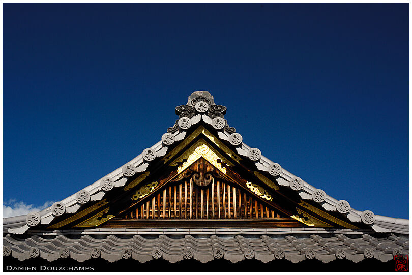Temple roof detail with dark blue sky, Shinsen-en garden, Kyoto, Japan
