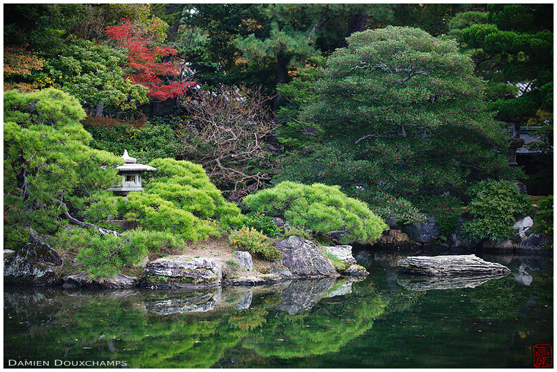 Stone lantern on a pond island in the Imperial Palace Goshō, Kyoto, Japan