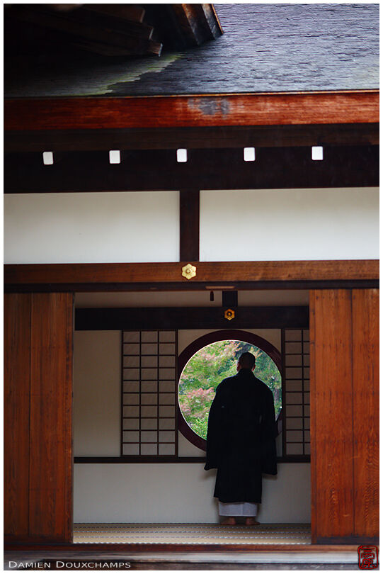Monk and round window, Manpuku-ji temple, Kyoto, Japan