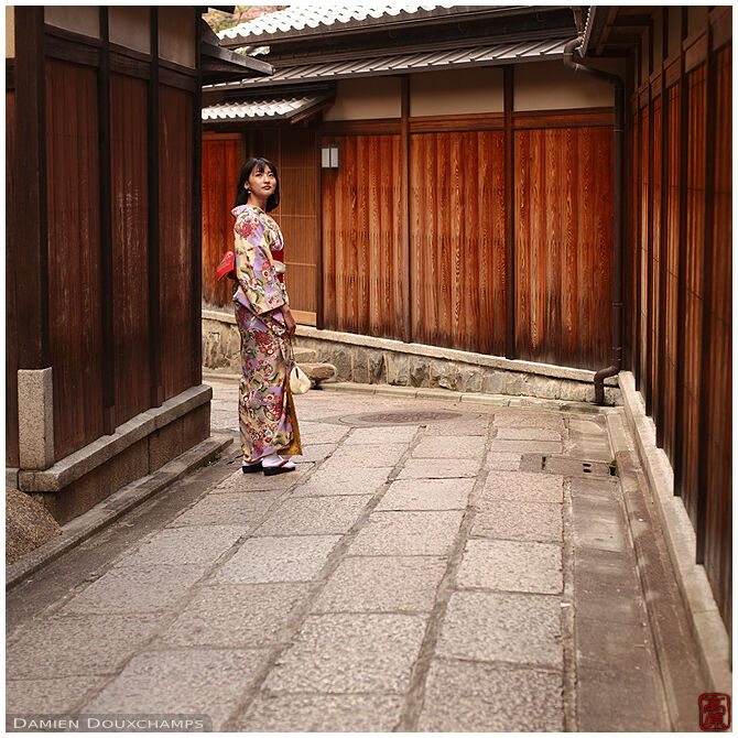 Woman in kimono in the old streets of Kyoto, Japan