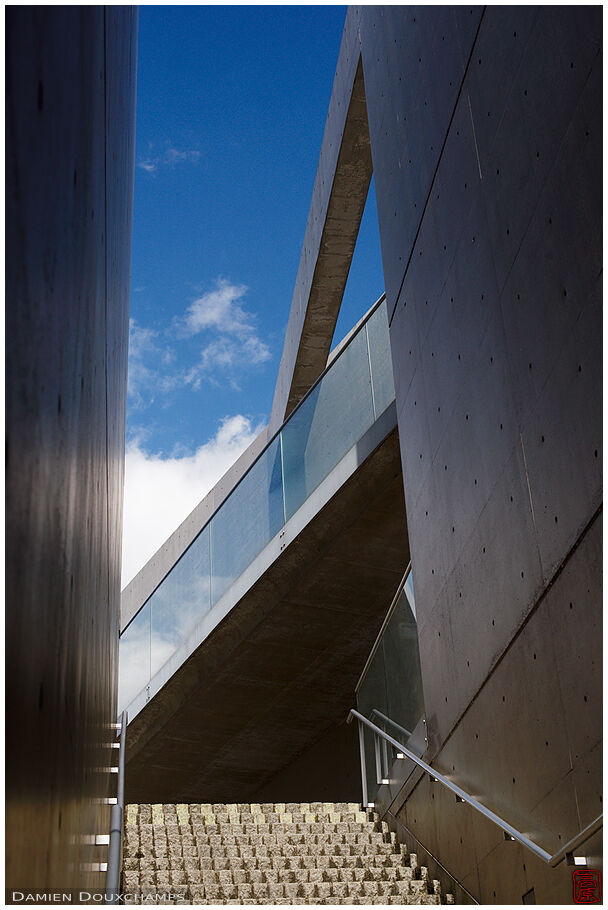 Blue sky over glass and concrete architecture, Kyoto, Japan