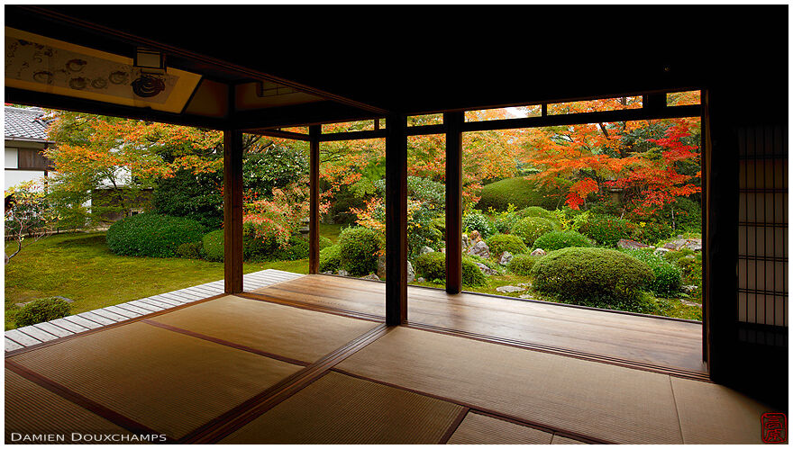 Tatami hall with view on Japanese garden and autumn colours, Genko-an temple, Kyoto, Japan