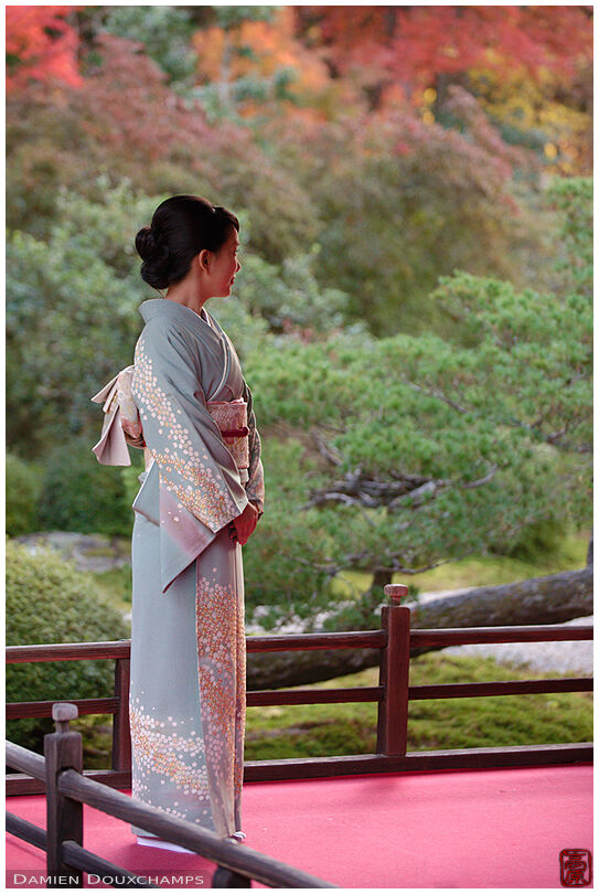 Woman in kimono posing on a terrace of Manshuin temple, Kyoto, Japan
