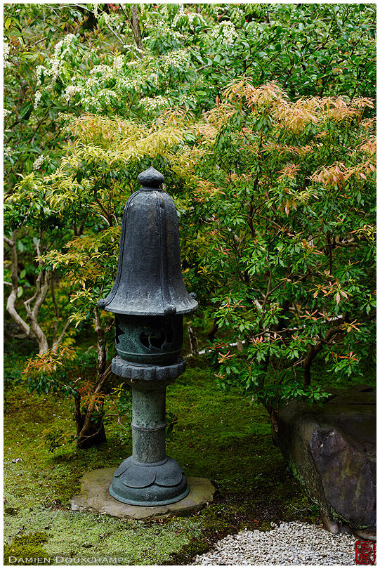 Funny looking lantern with tall hat in Ruriko-in temple, Kyoto, Japan