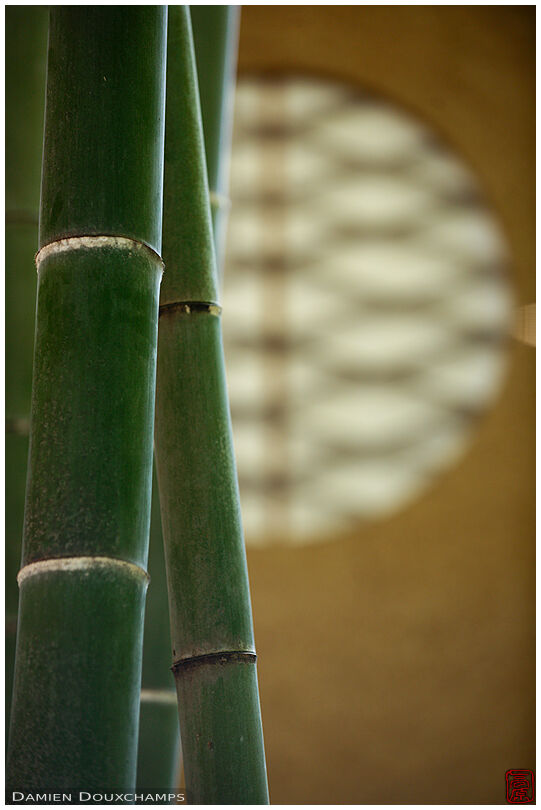 Bamboo and round window at the entrance of Shisendo temple, Kyoto, Japan