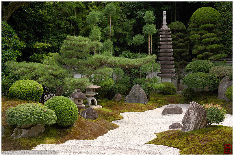 Two lanterns and a stone pagoda in Reiun-in temple dry landscape garden, Kyoto, Japan