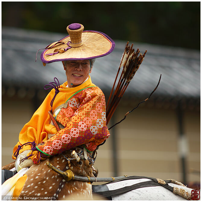 Mounted archer in bright orange clothing, Jidai festival, Kyoto, Japan
