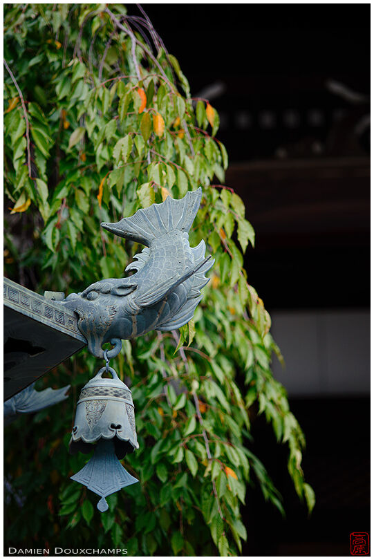 Elaborate lantern detail with fish and bell, Yusei-ji temple, Kyoto, Japan