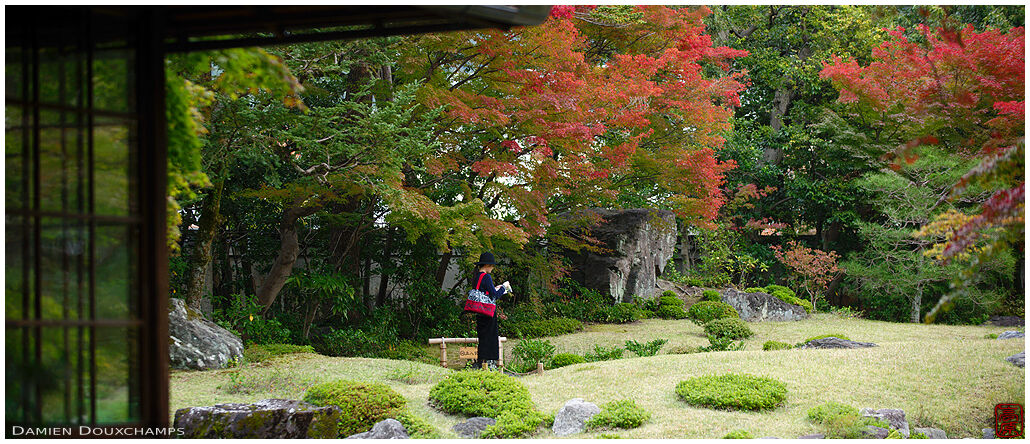 Visitor strolling in Murin-an garden, Kyoto, Japan