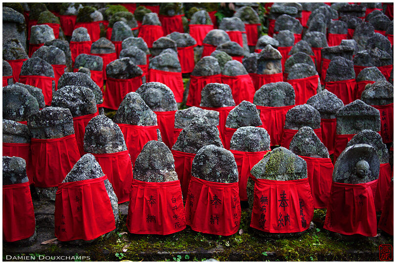 Old jizo statues with red bibs, Risho-in temple, Kyoto