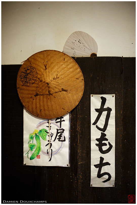 Old traditional hat and fan in the remote temple of Hogon-ji, Kyoto, Japan