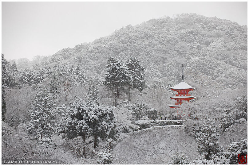 Red pagoda lost in winter landscape, Kiyomizu-dera temple, Kyoto, Japan