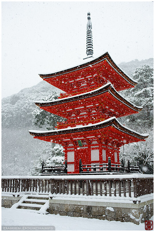 Snow falling on small red pagoda, Kiyomizu-dera temple, Kyoto