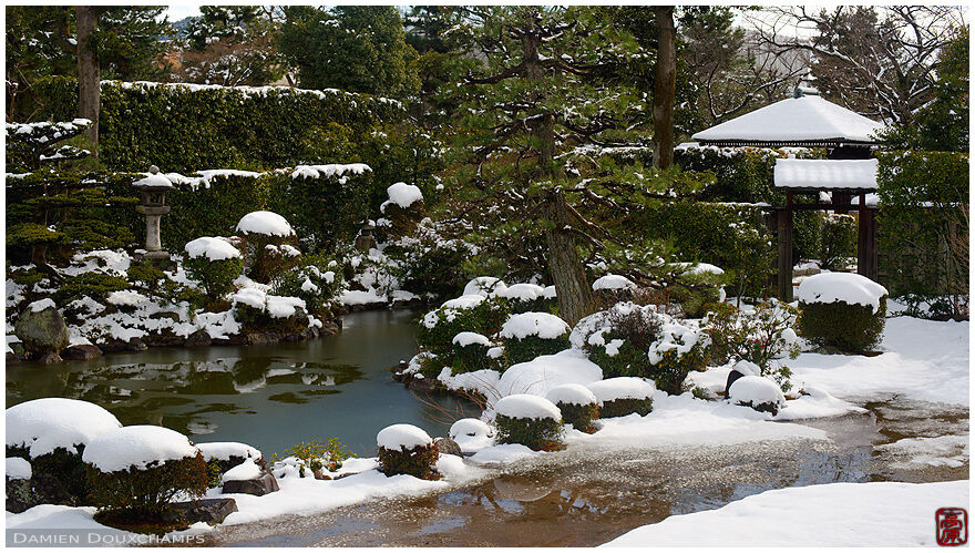 Pond garden with a light snow cover, Kyusho-in temple, Kyoto, Japan