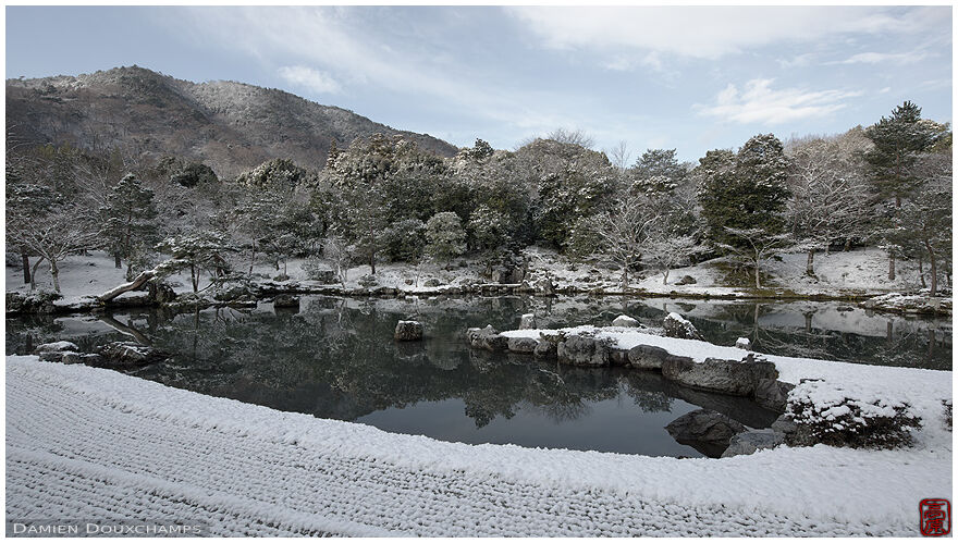 Thin sprinkle of snow on the pond of Tenryu-ji gardens, Kyoto, Japan