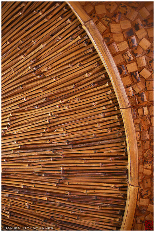 Circular and radial lines of bamboo ceiling decorations in the Kaguyahime Takegoten, Kyoto, Japan