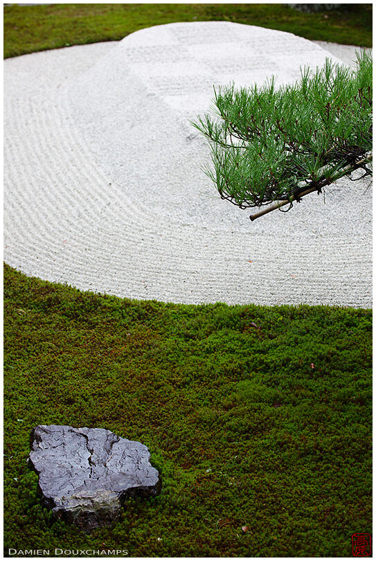 Sand and moss Japanese garden with stone and pine branch details, Eikan-do temple, Kyoto, Japan