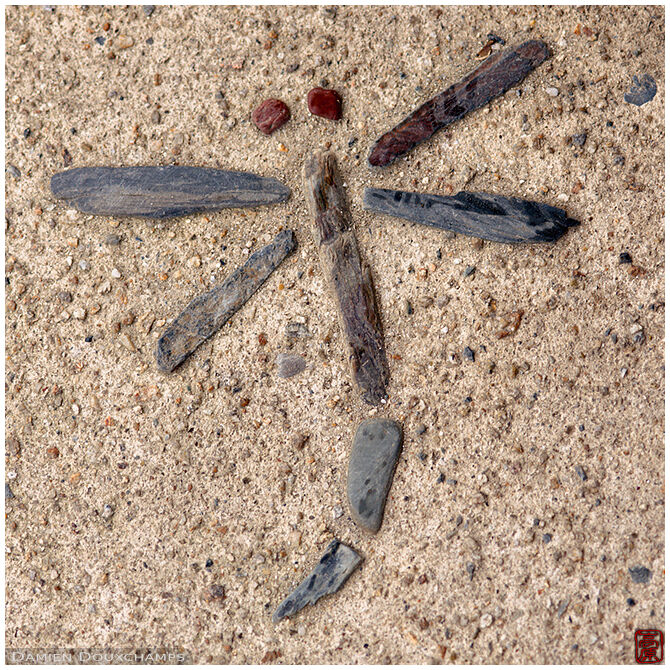 Dragonfly inlaid in concrete slab at the entrance of Enko-ji temple, Kyoto, Japan