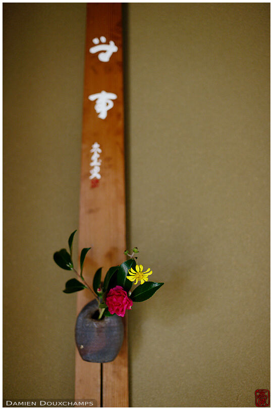 Ikebana flower arrangement hanging to the wall of a tea room tokonoma in Daichi-ji temple, Kyoto, Japan